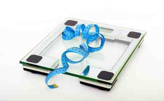 Blue Tape Measuring on Clear Glass Square Weighing Scale