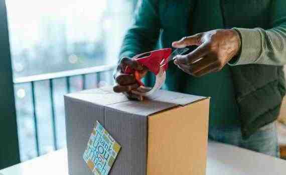 A Person Packing a Box