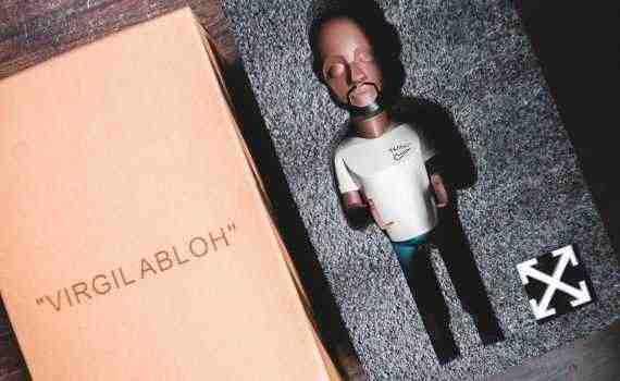 Plastic miniature in packing near carton box