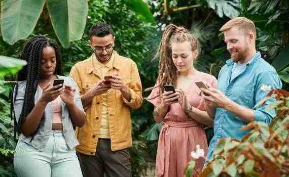 Photo Of People Holding Cellphones